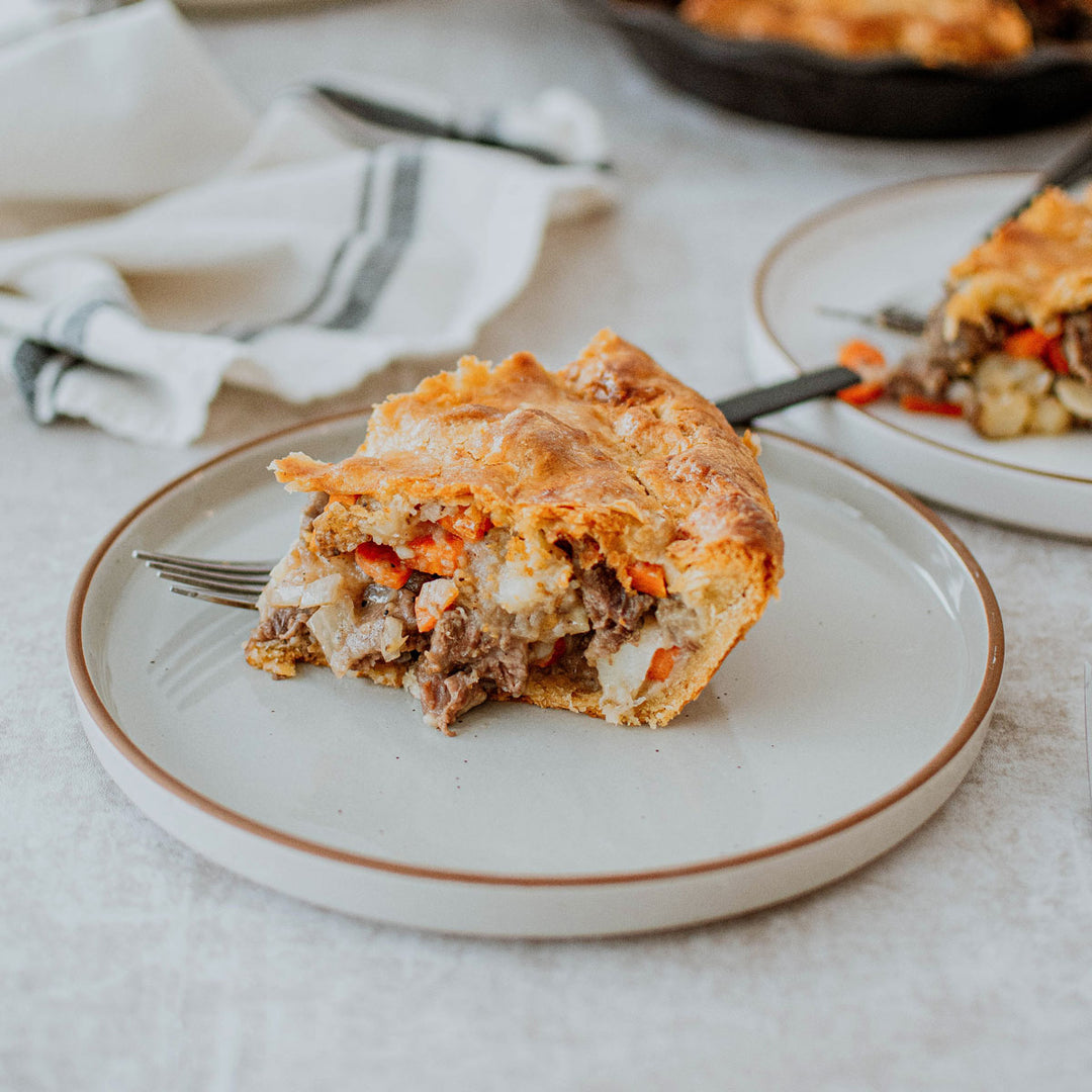 organic chuck roast in a hearty meat pie slice on a plate