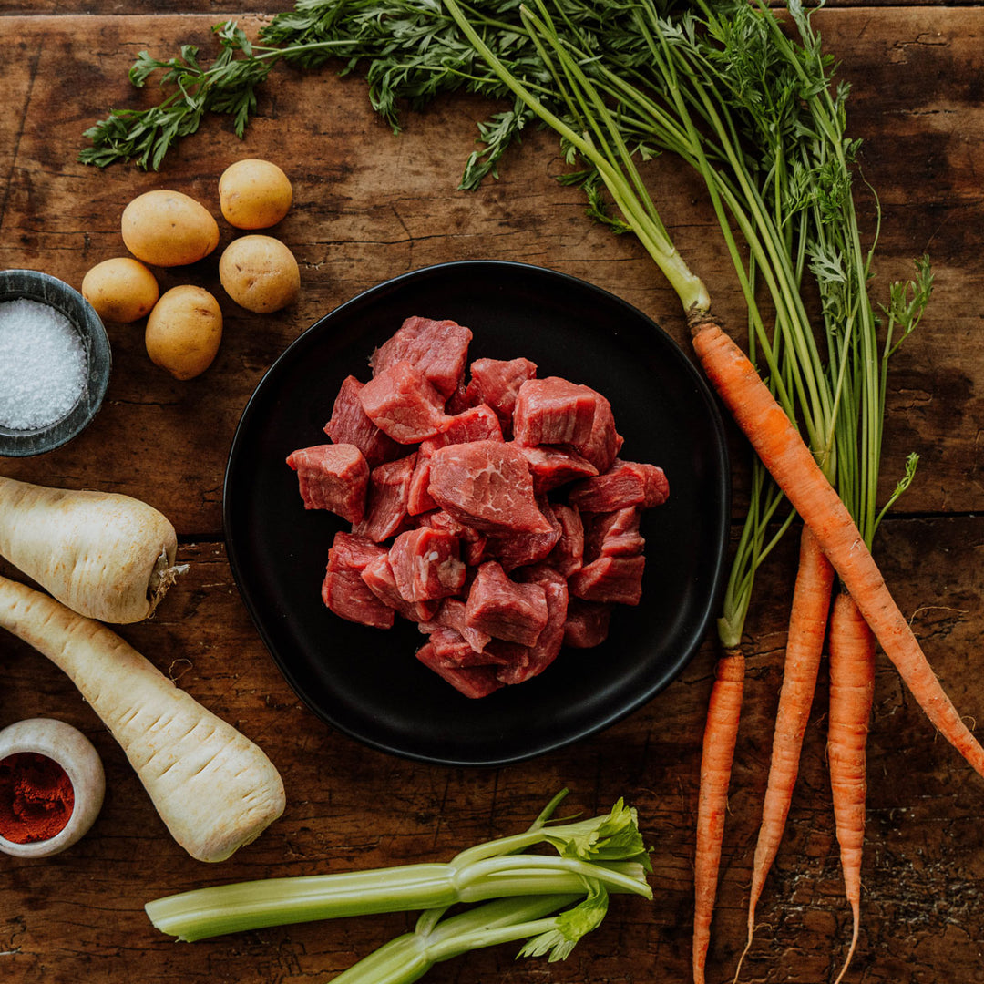 raw organic stew meat  on a plate